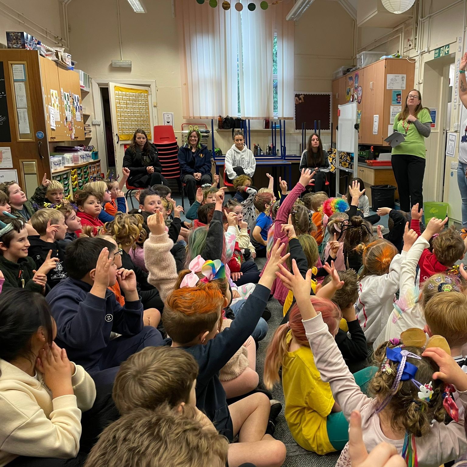 holding up hands in class